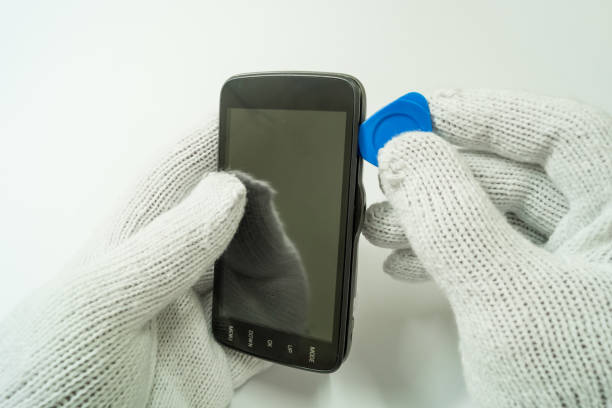istock Disassembly car camera to replace new battery on white background, isolated, Car maintenance service. 1267700400
