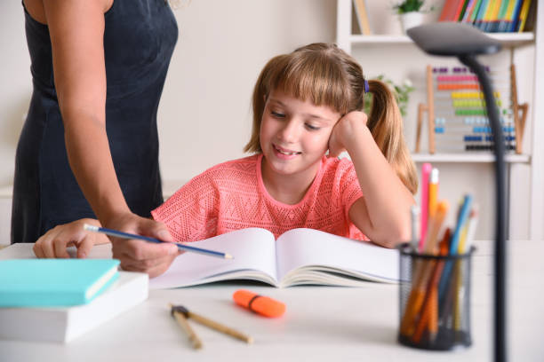 istock Girl studying at home with teacher 1267701202