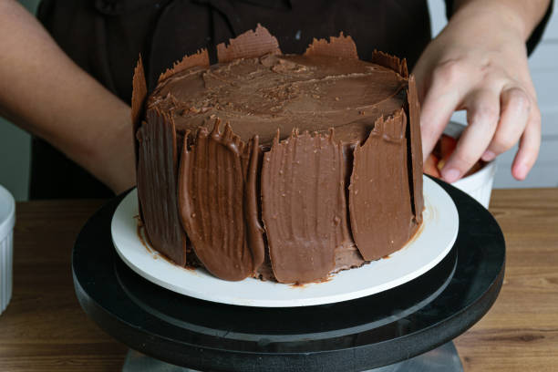 istock Chocolate cake, with chocolate plates, ready for confectioners to put fresh strawberries on it. 1267702201