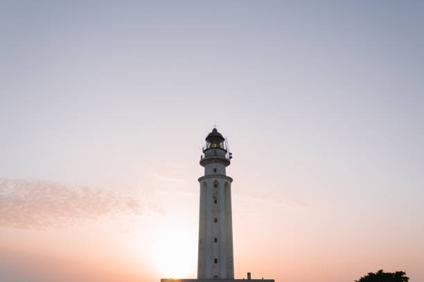 istock White lighthouse at sunset in the Atlantic Ocean. 1267705028