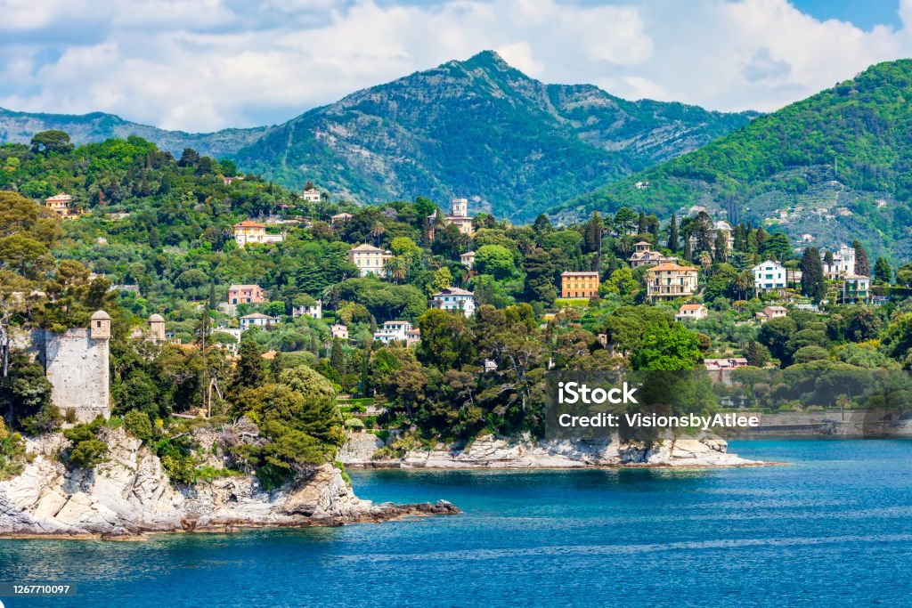 Approaching Portofino on our Ferry we pass the town of Rapallo rising up from the coastline Santa Margherita Ligure Stock Photo