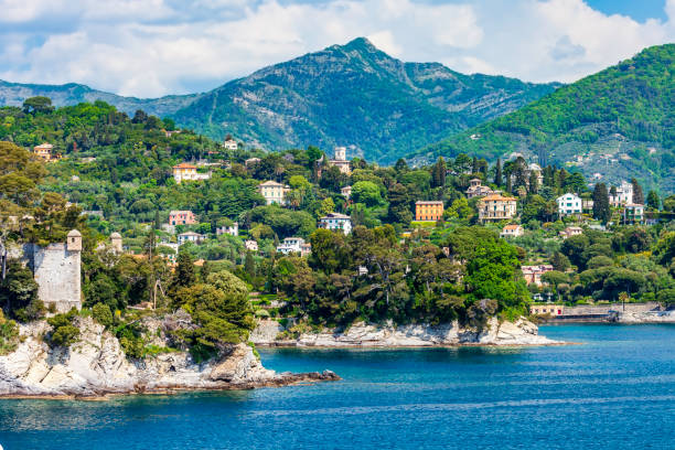 Approaching Portofino on our Ferry we pass the town of Rapallo rising up from the coastline Approaching Portofino on our Ferry we pass the town of Rapallo rising up from the coastline santa margherita ligure italy stock pictures, royalty-free photos & images