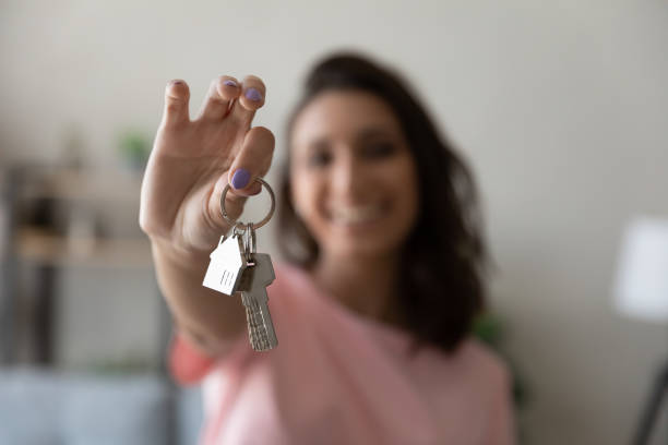 Female tenant show keys moving to new home Crop close up of female tenant renter show praise house keys moving to first own new apartment or house, happy woman owner buy purchase home, relocate to dwelling, rental, rent, ownership concept home ownership women stock pictures, royalty-free photos & images