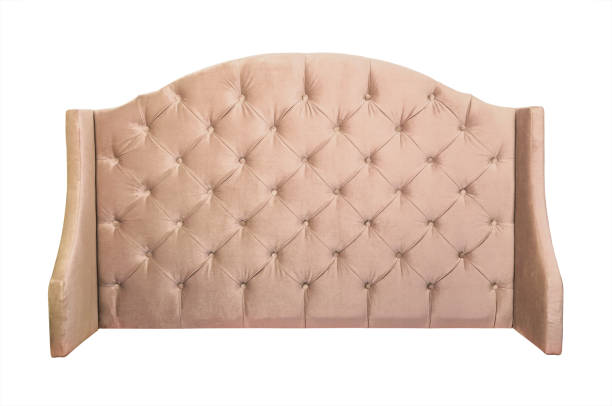 istock Beige velvet bed headboard isolated on white 1267717545