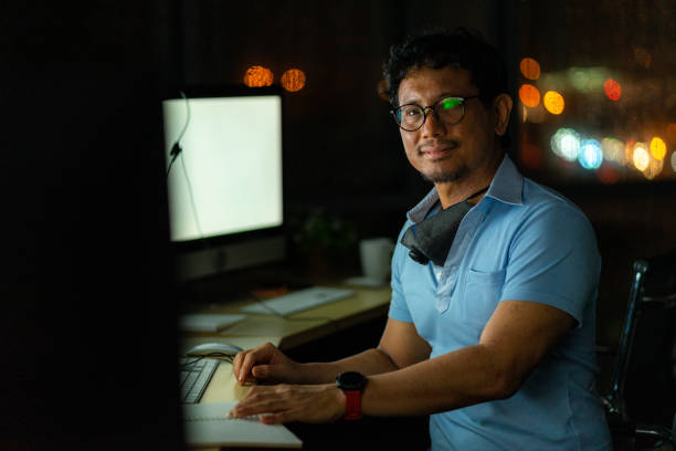 istock Engineering technical worker working at night or what time with the computer monitor and headphone in the office 1267718482