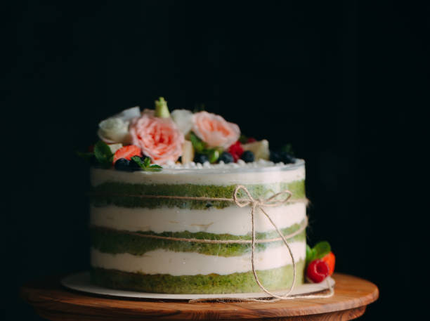 istock Cake is decorated with flowers on a dark background. 1267722205