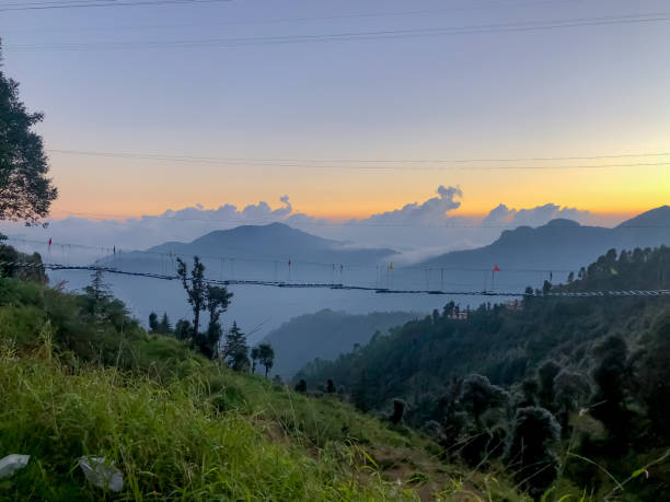 istock Beautiful clouds and mountains  click kanatal Uttarakhand  india 1267722812