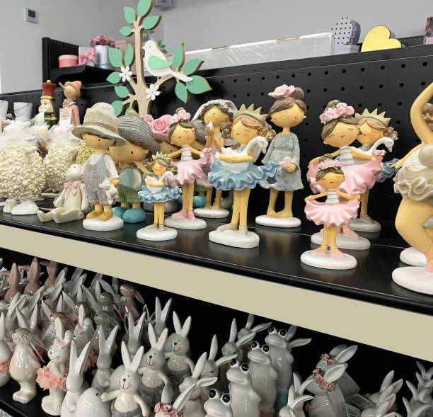 Porcelain dolls on the store shelf.