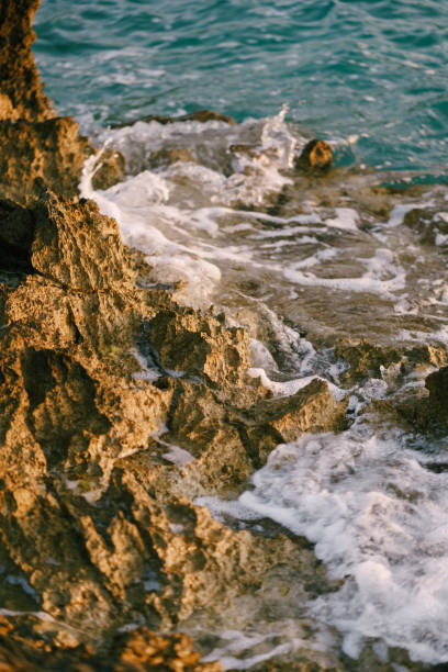 istock Rocks in the sea, waves hitting rocks. 1267724790