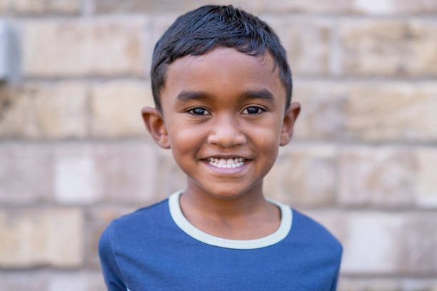 istock Handsome 6 year old boy smiling at the camera 1267725988