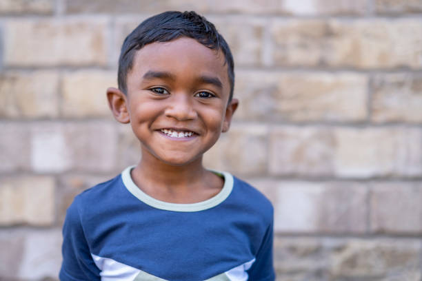 istock Handsome 6 year old boy smiling at the camera 1267725994
