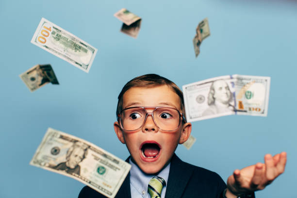 istock Young Boy Small Business Owner with Money 1267726988