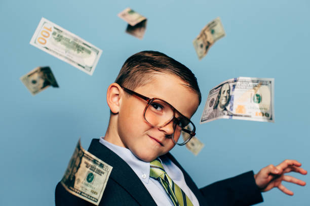 istock Young Boy Small Business Owner with Money 1267726989
