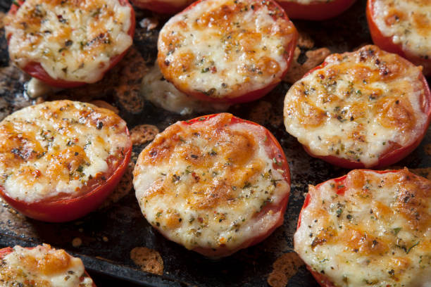 istock Cheesy Baked Tomatoes 1267728910