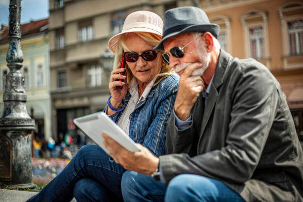 istock A modern elderly couple looks at a tablet and talks online - 1267731888