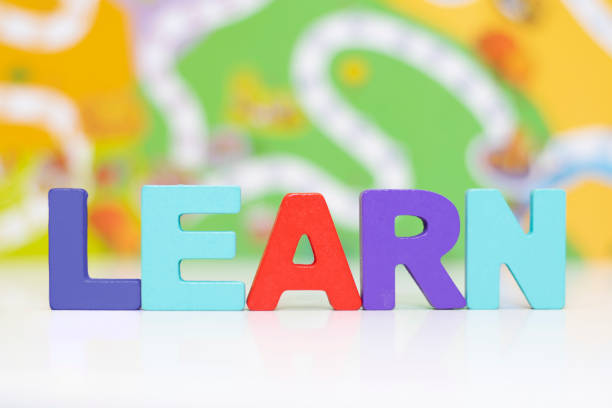 Learn The word "Learn" made out of Capital letter blocks with a background depicting learning path. spelling bee stock pictures, royalty-free photos & images