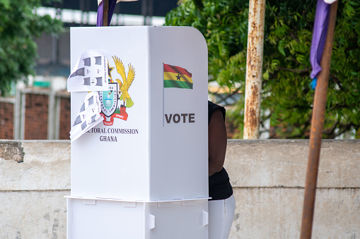 ACCRA, GHANA - June 20, 2020: People mark their ballot in the privacy of a voting booth in Ghana