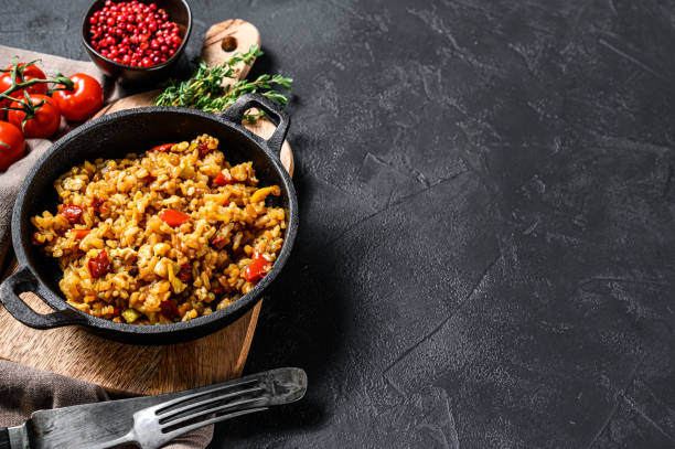 istock Fried Rice with Vegetables and eggs. Chinese Cuisine.  Black background. Top view. Copy space 1267735366