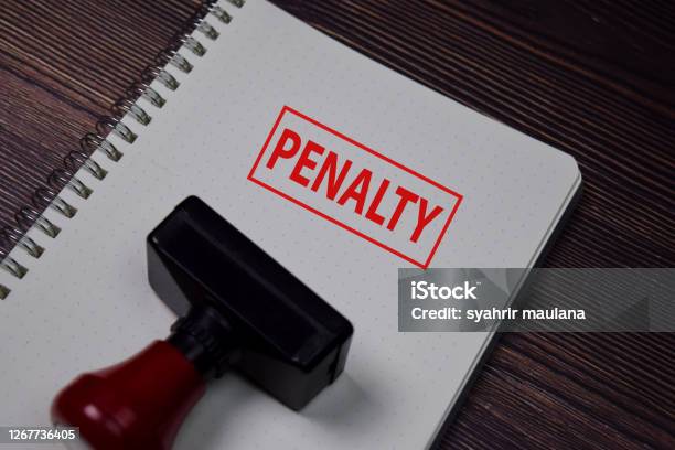 Red Handle Rubber Stamper And Penalty Text Isolated On White Background Stock Photo - Download Image Now