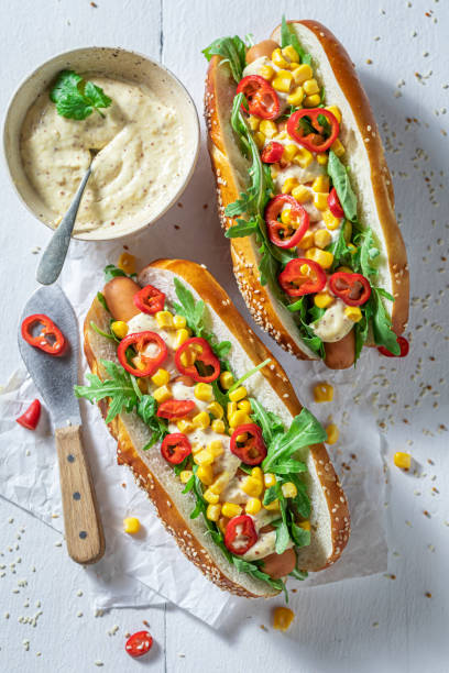 istock Homemade hot dogs with arugula, corn and chilli pepper 1267736480
