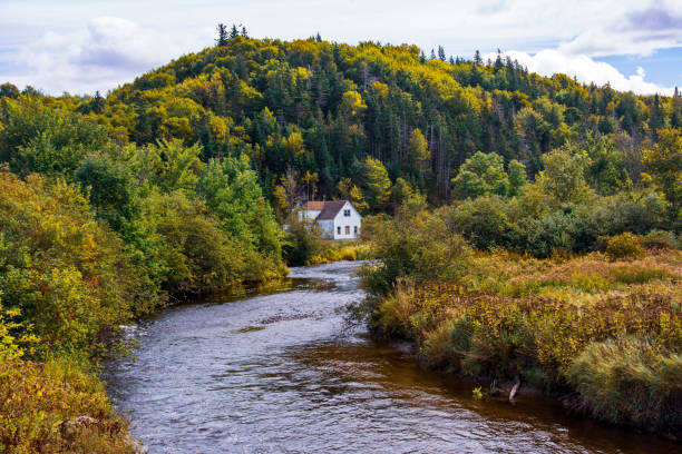 istock House near a river in rural Nova Scotia 1267740825