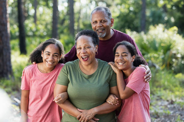 istock Identical twin sisters with their grandparents 1267740913