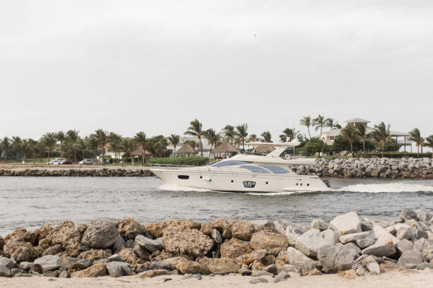 istock White Boat on the Jupiter Inlet in Jupiter, Florida 1267745412