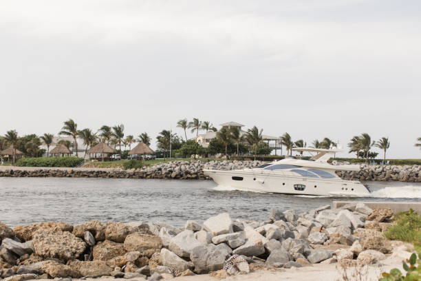 istock White Boat on the Jupiter Inlet in Jupiter, Florida 1267746463