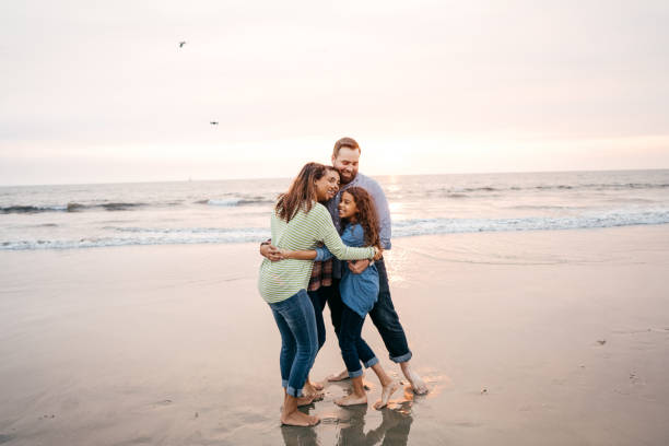 istock Sunset at the beach with family 1267747829