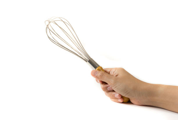 istock Metal whisk in hand on white. 1267748075