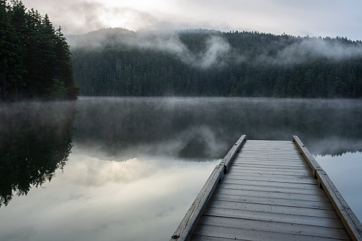 Sunrise at Mountain Lake on Orcas Island, Washington with mist and fog rising from the water