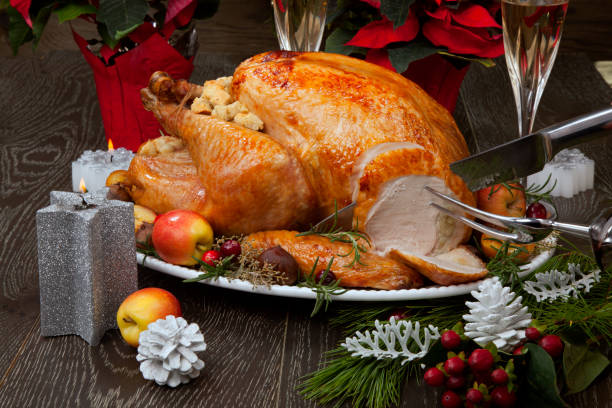 istock Carving Roasted Christmas Turkey with Grab Apples 1267756421