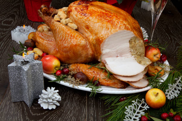 istock Carving Roasted Christmas Turkey with Grab Apples 1267756432