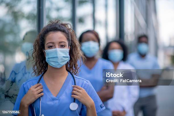 Group Of Doctors Outside Stock Photo - Download Image Now - Nurse, Protective Face Mask, Healthcare And Medicine