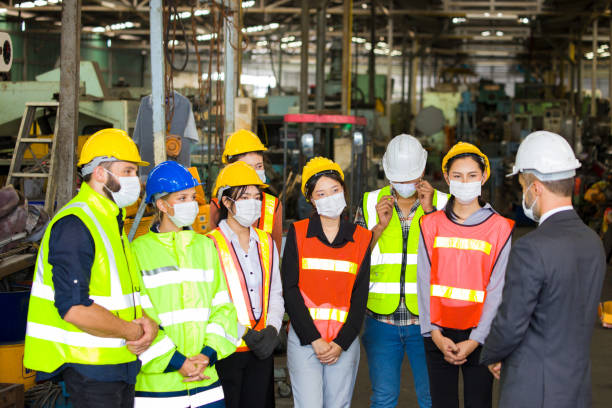 istock Factory workers meeting in the morning. 1267765476