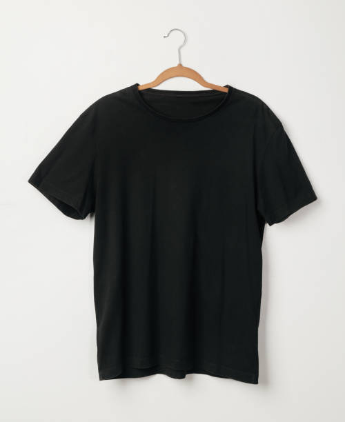 istock Blank Black T-Shirts mockup hanging on white wall, Template for your design 1267770733