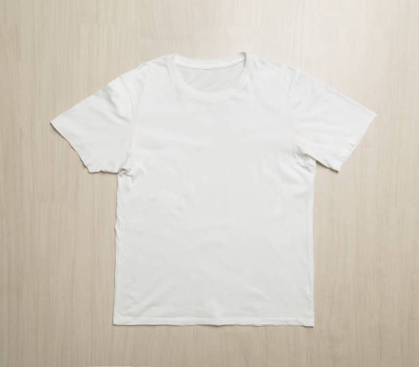istock White T-shirts mockup template on wooden floor 1267770741