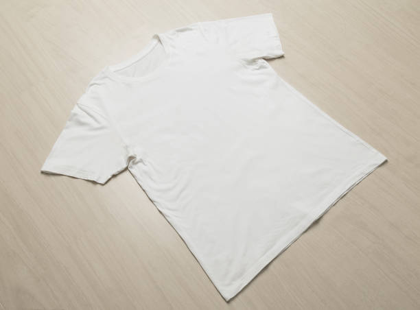istock White T-shirts mockup template on wooden floor 1267770743
