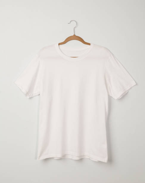 istock Blank White T-Shirts mockup hanging on white wall, Template for your design 1267770761