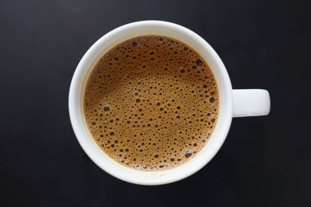 istock A cup of coffee on black background 1267780287