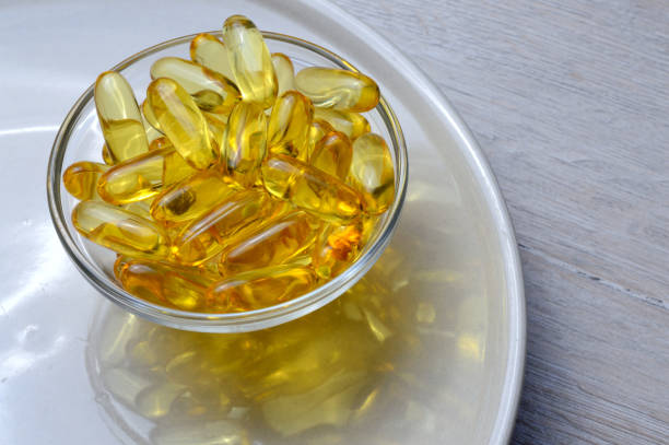 istock Omega-3 and Vitamin D fish oil capsules 1267783341