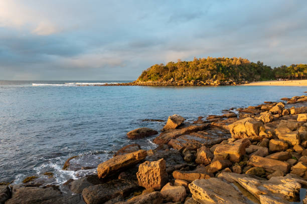istock Shelly Beach Blue Waters and Shelly Head Lookout Background Blur 1267791441