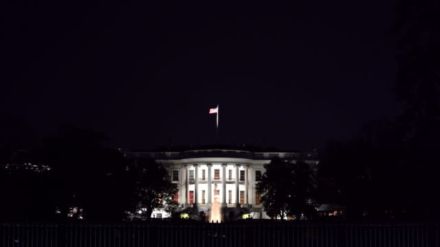 Night Architecture of White house in Washington DC with US Flag, District of Columbia USA