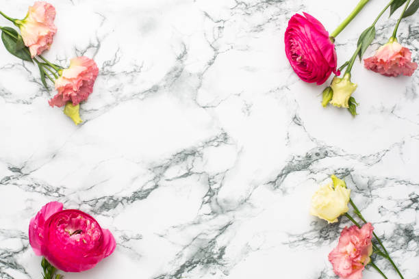 istock Pink and white flower bouquet on marble background with copyspace 1267809335