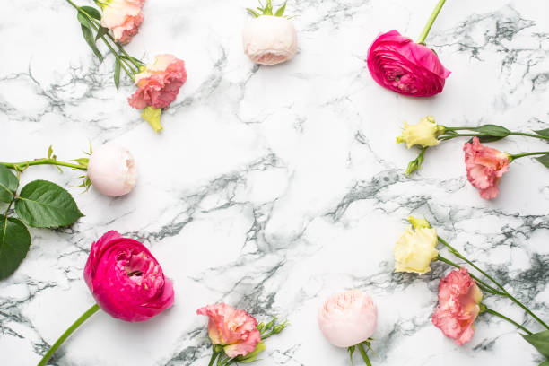 istock Pink and white flower bouquet on marble background with copyspace 1267809336