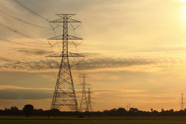 istock High voltage pylon in the field 1267821141