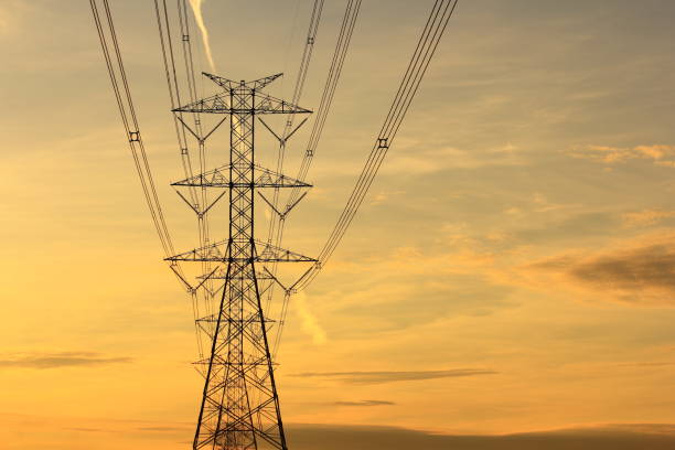 istock High voltage pylon in the field 1267821146