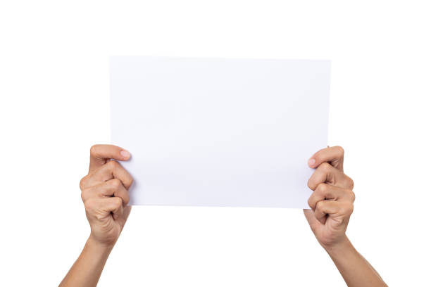 istock Mockup man holding white paper isolated on a white background 1267824541