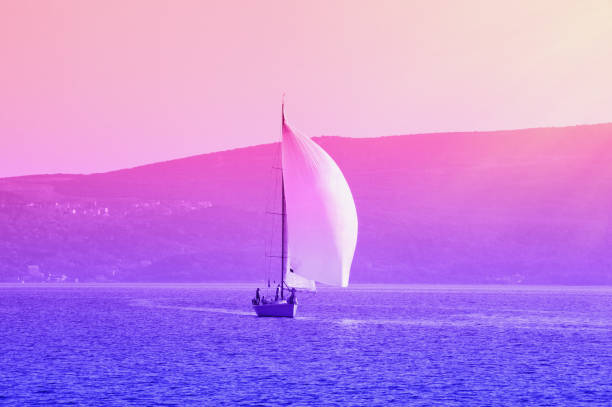 Sailing boat on the water, gradient toning. Montenegro, Bay of Kotor. Travel concept