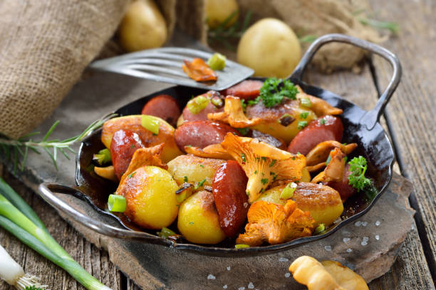 istock Fried potatoes with chanterelles and cabanossi 1267845902